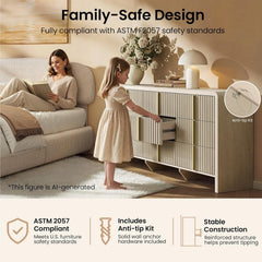 A child opens one drawer of a cream fluted dresser, An inset shows a wall anchor cable behind the cabinet