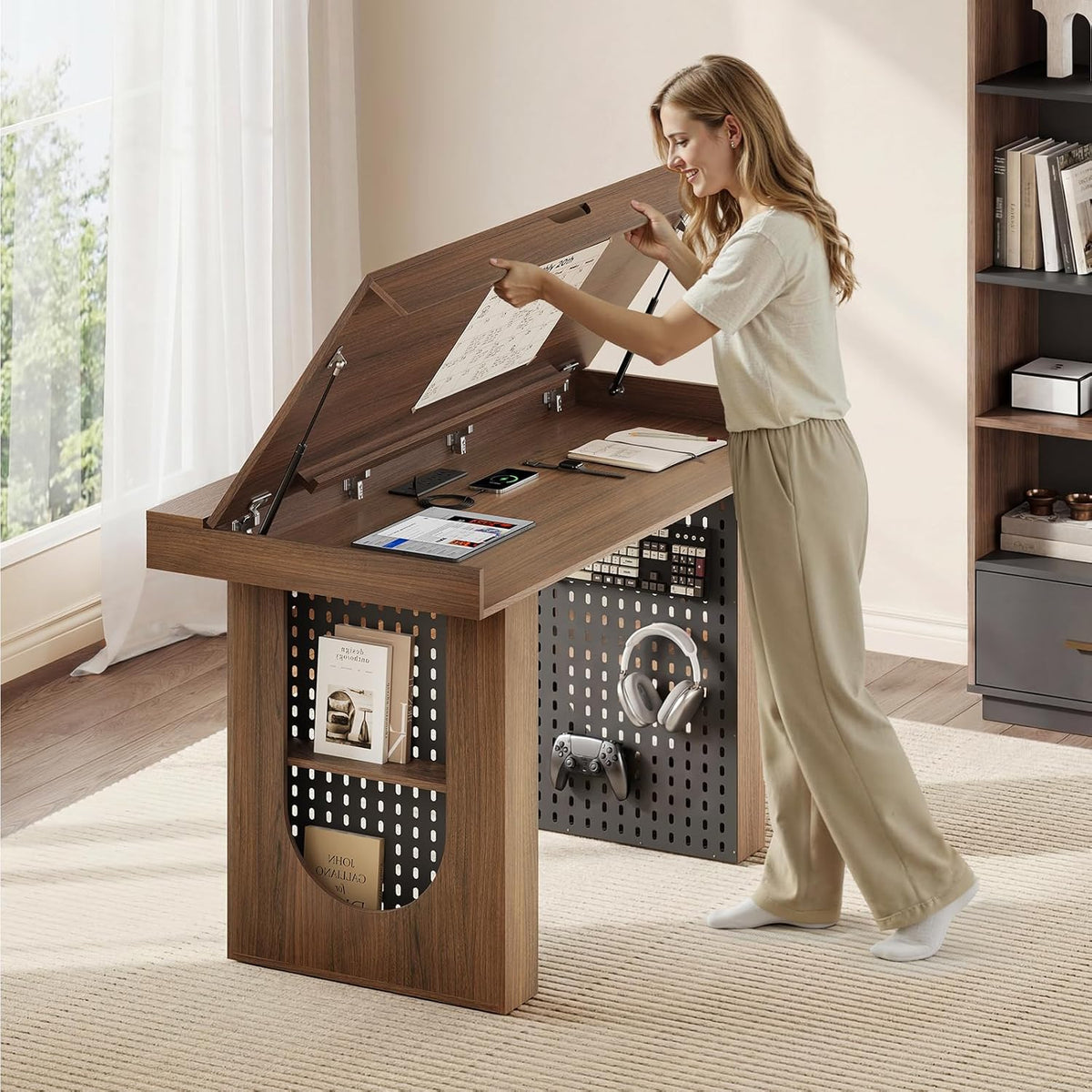 Woman lifting the top of a compact foldable work cabinet