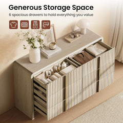 Six drawers are shown open with folded clothing, towels, and small bottles inside
