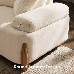 Close-up of a cream upholstered armchair with a rounded wooden arm support; an overlay marks the armrest as 13 inches (33 cm) wide.