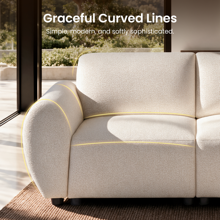 Close-up of a cream-colored textured sofa with a rounded arm and short dark feet, with yellow lines tracing its curved edges beside large windows.