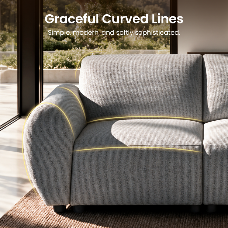 Close-up of a light gray sofa with a rounded arm, textured upholstery and short black feet, with yellow lines tracing its curves beside sunlit windows.