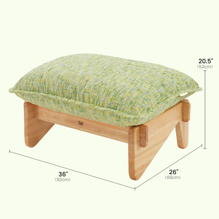 Dimension diagram of a low stool with a pale green textured cushion and light brown frame, labeled 36 inches wide, 26 inches deep and 20.5 inches high.