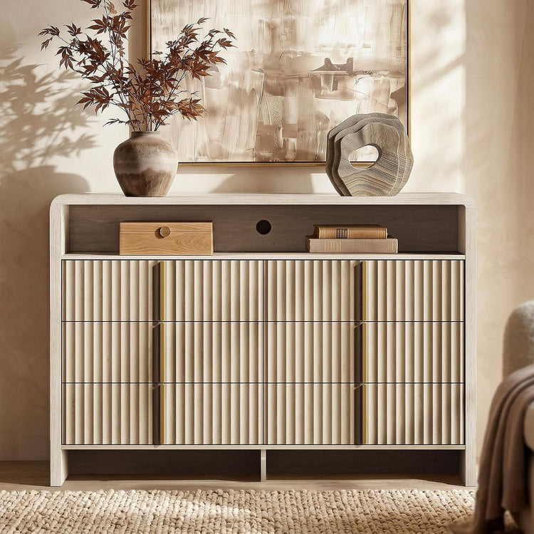 Dark wood sideboard with three ribbed front doors, slim gold pulls, and decor on top