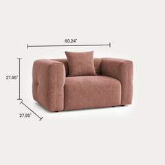 Dimension graphic of a pink upholstered armchair with a matching cushion.