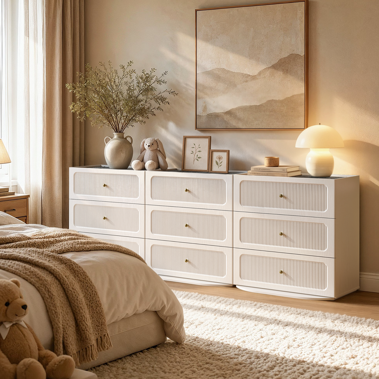 White dresser shown in a bedroom