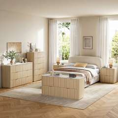 Light wood-toned bedroom furniture shown in a bedroom