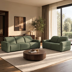 Green upholstered three-seat sofa and loveseat in a sunlit living room.