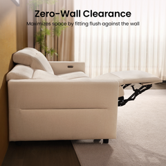 Side view shows a cream reclining sofa against a wall with its footrest extended