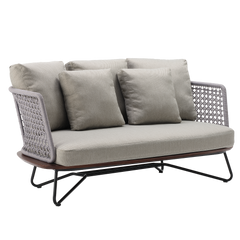 A cushioned sofa has woven side panels, three front pillows, a wood-grain base, and angular legs