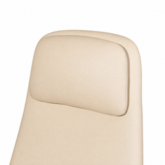 Close-up of a cream-colored chair back with a raised, rounded rectangular headrest cushion and stitching along the edges.