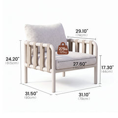 An armchair with a loose back cushion is surrounded by measurement lines
