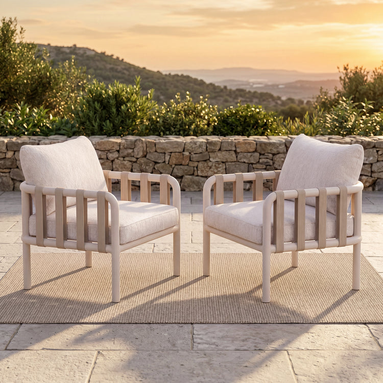 Two outdoor armchairs shown in an outdoor setting
