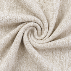 Close-up of cream-colored looped fabric gathered into spiral folds