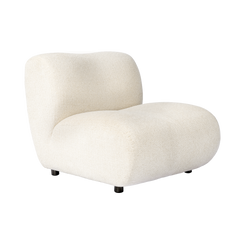 A rounded white boucle accent chair with a curved back and concealed short feet appears on white
