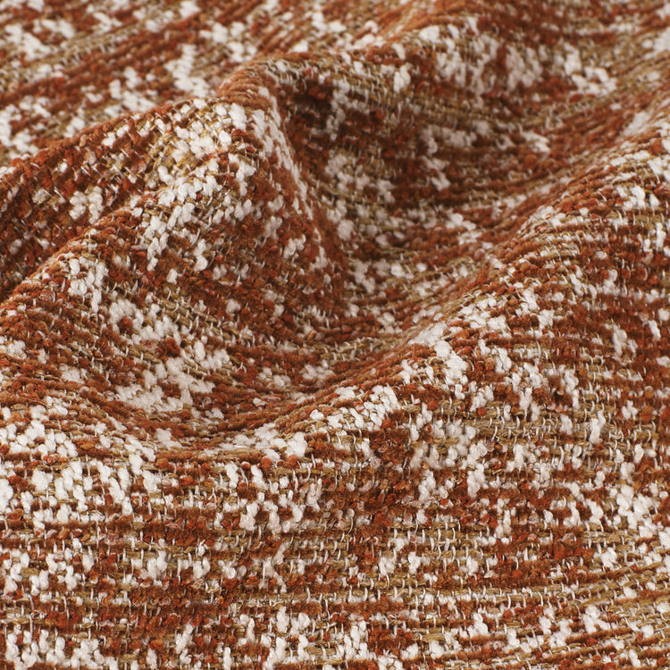 Rust, cream, and tan woven fabric has a nubby textured surface