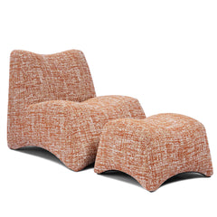 Rounded orange-and-white chair is paired with a matching low stool, Both pieces have curved silhouettes and mottled surfaces