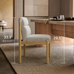 Height comparison diagram showing a light upholstered chair with a tan frame beside a table, with vertical measurement lines marking the chair back and tabletop heights.
