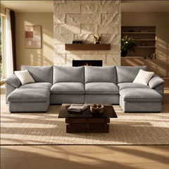 Gray U-shaped modular sofa with two chaise sections in a staged living room.