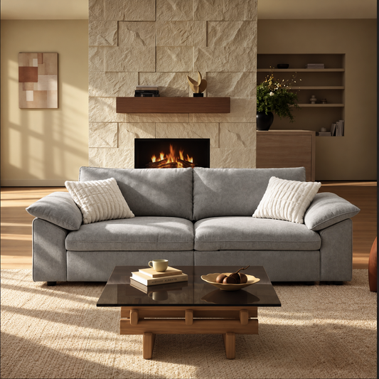 Gray two-seat sofa with wide padded arms in a modern living room.