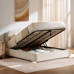 Storage bed shown with its wood-slat platform lifted over the compartment