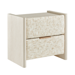 Beige nightstand with raised side panels, two cream textured drawer fronts and a gold-tone pull
