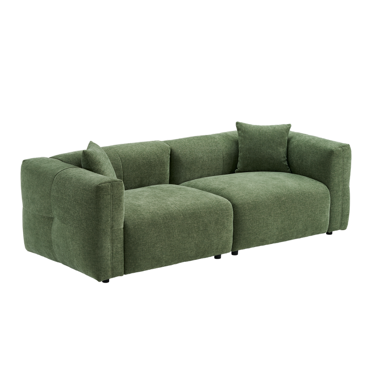 Green upholstered two-seat sofa with wide arms and two matching pillows