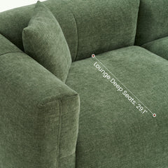 Close-up of a green upholstered sofa with a labeled lounge seat dimension.
