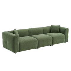 Green upholstered three-seat sofa with two matching throw pillows