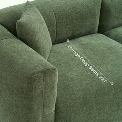 Diagram labeling the lounge depth across a green upholstered sofa seat.