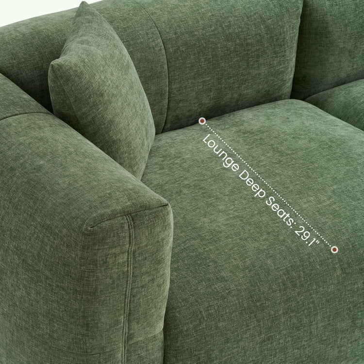 Diagram labeling the lounge depth across a green upholstered sofa seat.