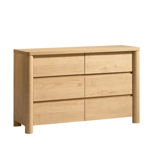 Light wood six-drawer dresser with rounded front posts.