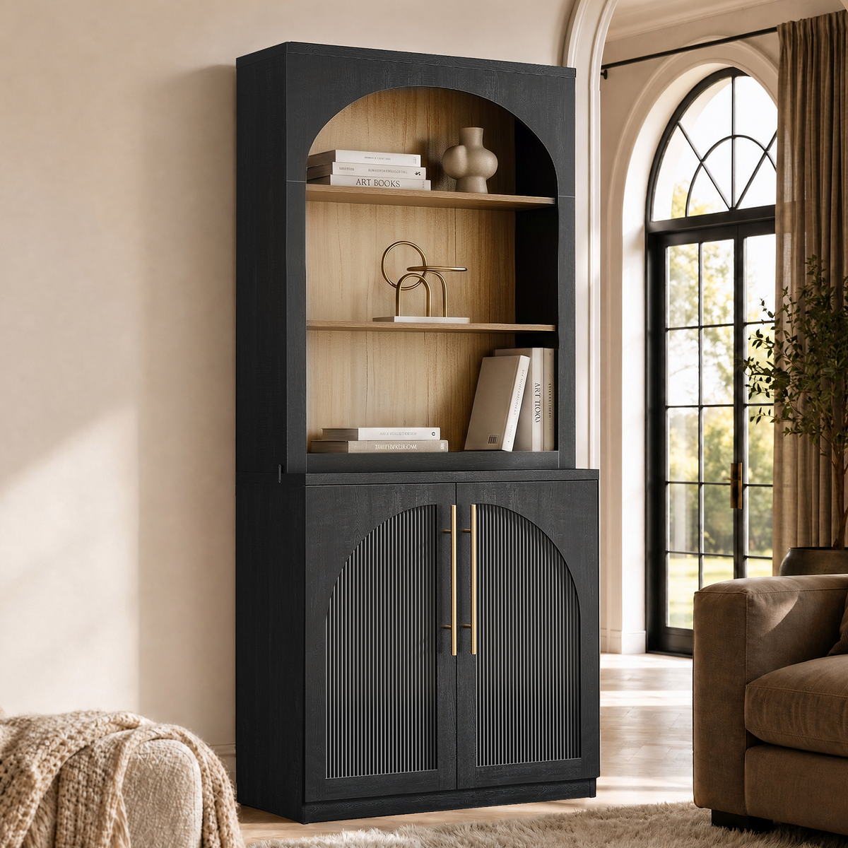 Tall black arched bookcase with open shelves, books, decor, and fluted cabinet doors