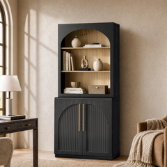 A tall cabinet has three open display shelves above two vertically fluted lower doors