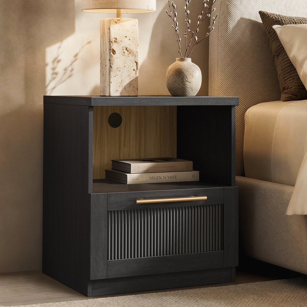 The cabinet has one open shelf above a lower fluted door with a horizontal gold-tone handle