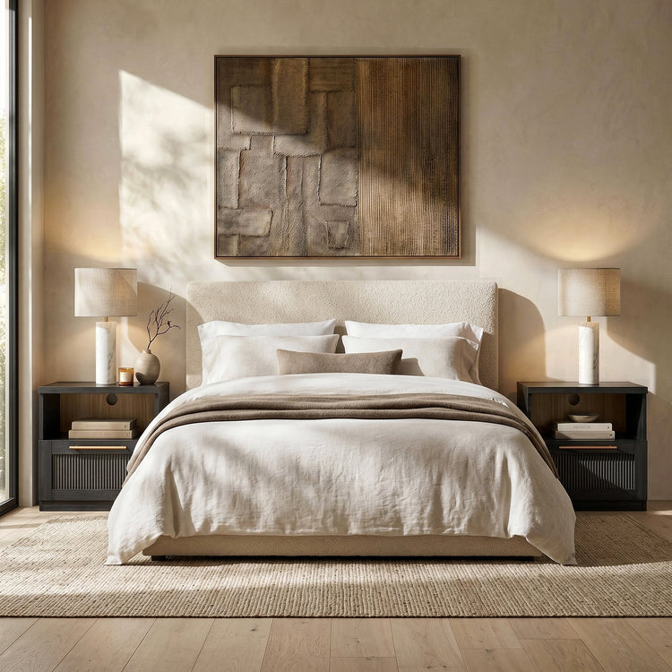 Black nightstands with open wood-tone cubbies and ribbed drawer fronts flanking a beige upholstered bed