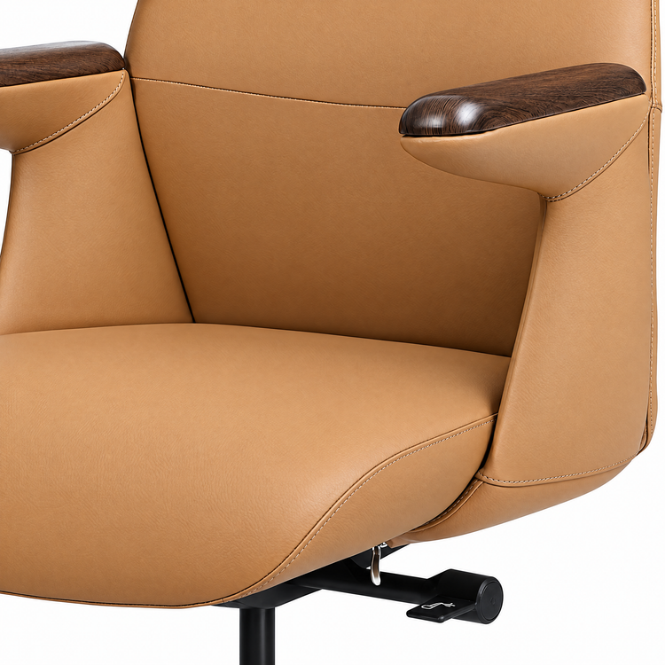 Close-up of a tan upholstered chair with light stitching, dark brown wood-grain armrest tops, and a black adjustment lever beneath the seat.