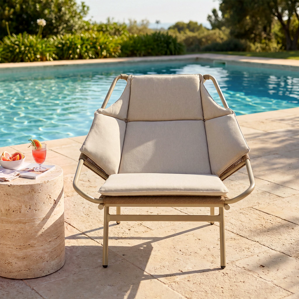 Cream sling lounge chair with a brown tubular frame positioned beside a swimming pool