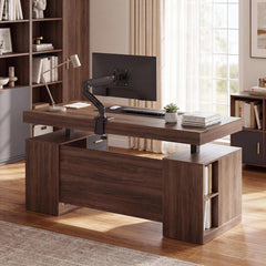 A dark wood desk with a raised desktop holds a monitor on an articulated arm, a keyboard, a lamp, a small plant, and stacked books.