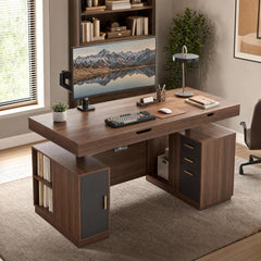 A dark wood desk with drawers, shelves, and a cabinet is set up with a monitor displaying snowy mountains reflected in a lake, a keyboard, mouse, and lamp.