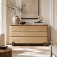 The dresser has six broad drawer fronts arranged in three rows