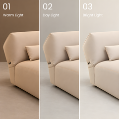 Beige sofa shown under warm, daylight, and bright lighting.