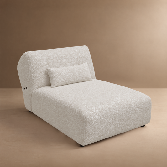White textured chaise lounge with a curved back and matching pillow