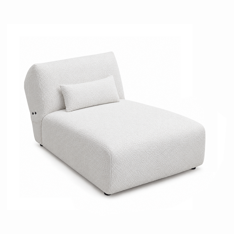 White textured chaise lounge with a curved back and matching lumbar pillow.