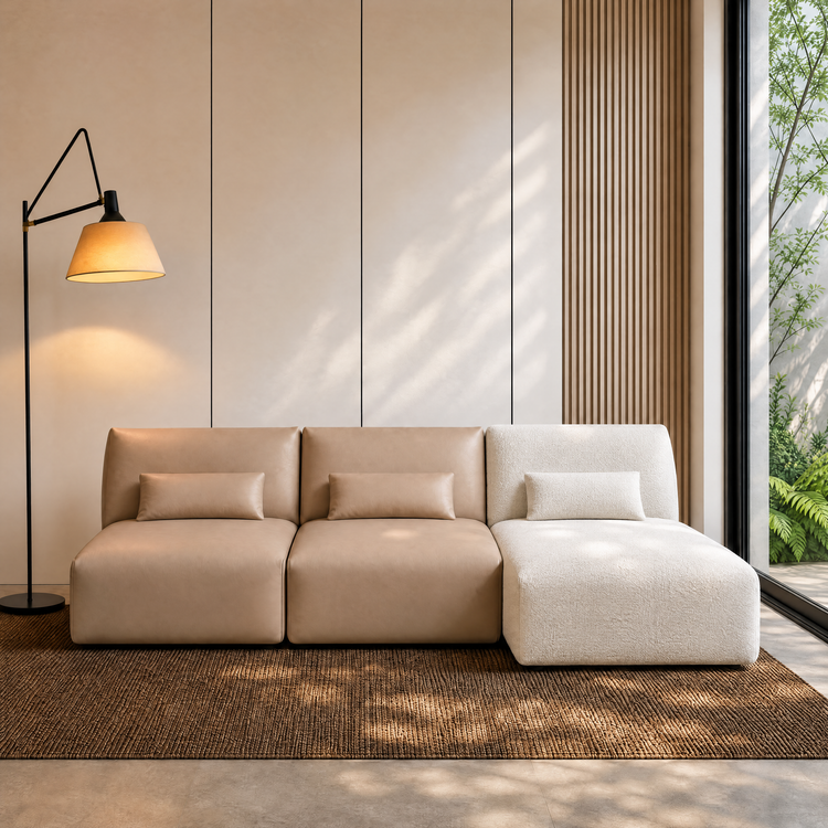 Tan and white modular sofa beside a floor lamp and large window