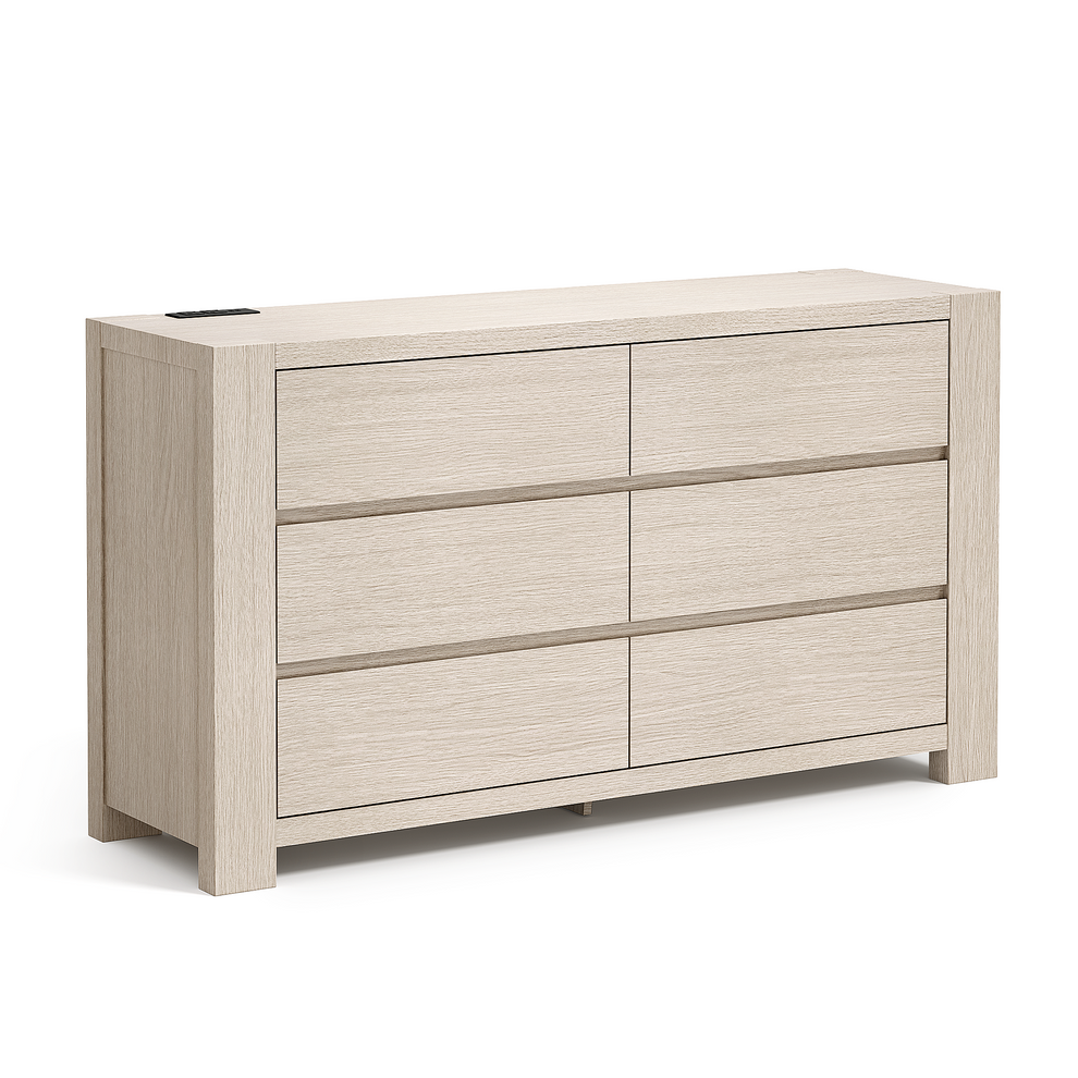 Wide pale wood dresser with six handleless drawers on a white background