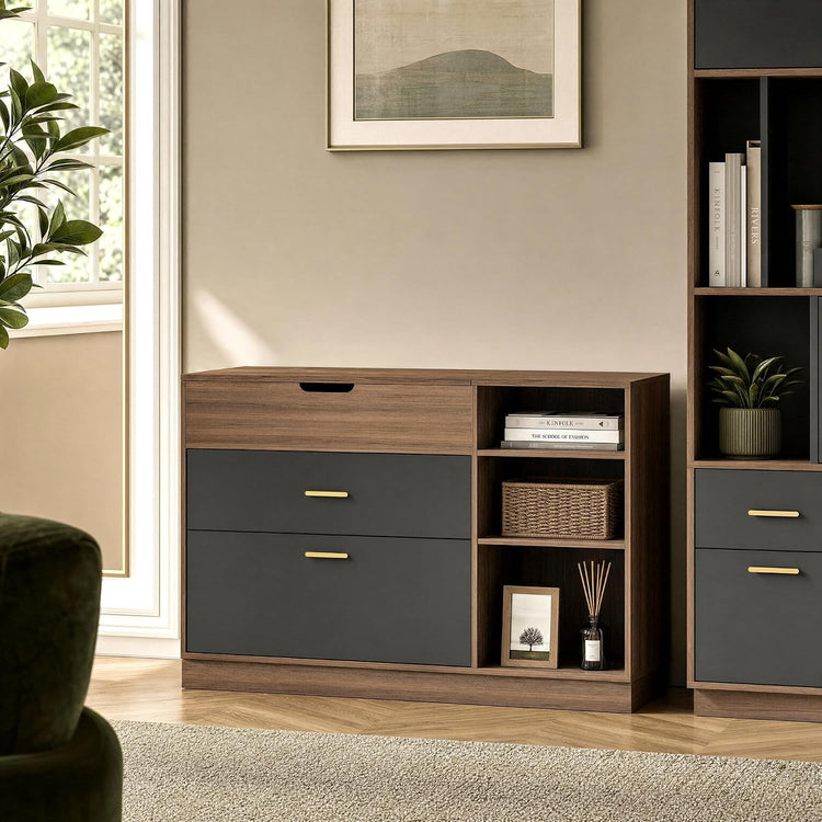 Brown wood-grain cabinet with two dark gray fronts, gold-colored handles, an upper drawer and three open shelves holding books, a woven basket, a framed picture and a reed diffuser.
