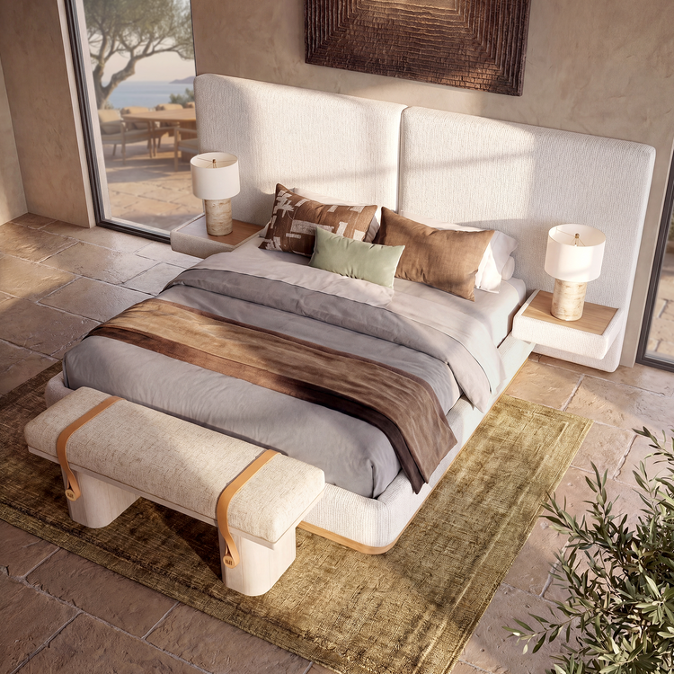 A bed with a split upholstered headboard stands between two bedside tables