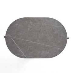 Top-down view of a gray rounded rectangular tabletop with white veining