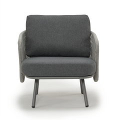 A dark gray cushioned armchair has rope-wrapped sides, angular arms, and four angled legs